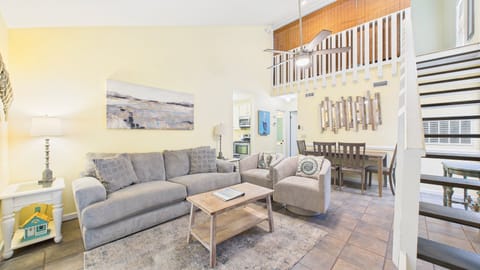 Open concept living area with stylish furnishings and ample seating