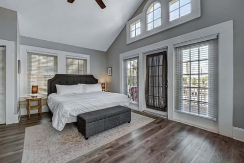 This bedroom has an attached balcony.