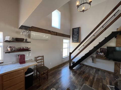 Staircase is steeper than normal stairs but has 2 handrails & antislip runners.