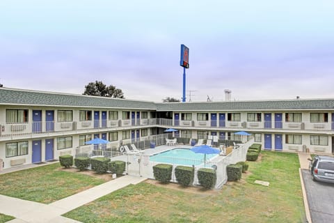 Seasonal outdoor pool, open 11:00 AM to 9:00 PM, pool umbrellas