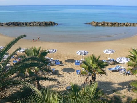 On the beach, sun loungers, beach umbrellas, beach towels