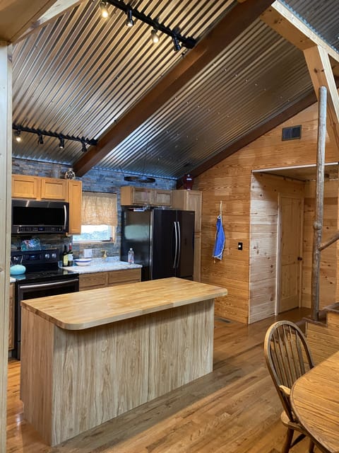 Kitchen with large island is fully stocked for cooking during your stay