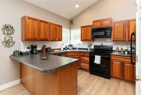 Full kitchen with all appliances, silverware, plateware, cups & mugs, pots & pans, Toaster, knife set, free coffee & more!