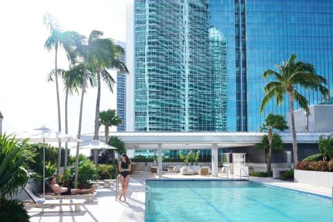 Outdoor pool, open 7:00 AM to 7:00 PM, pool umbrellas, sun loungers