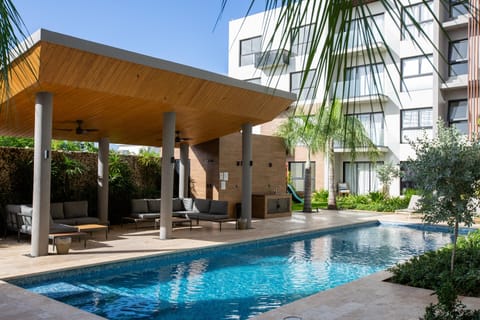 Outdoor Lounge: Relax under the stylish pergola, just steps from the sparkling pool!