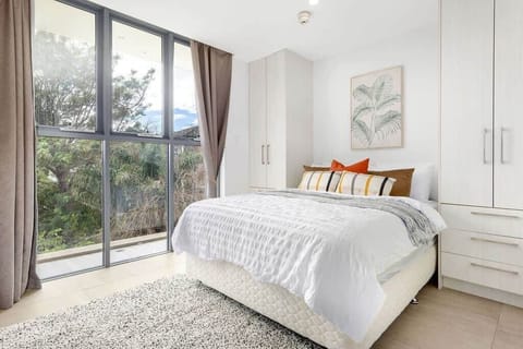 A double sized bed with plush pillows.