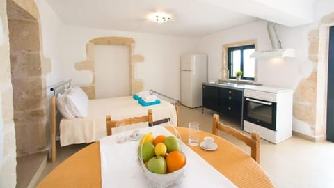 Bright, Spacious Bedroom with Kitchenette and Dining Table