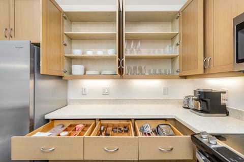 Fully stocked kitchen with all dining plates, silverwares, glasses, cooking utensils