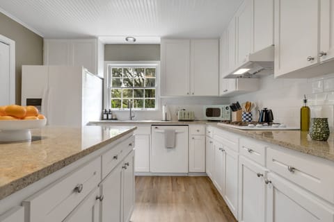 Kitchen hallway featuring spacious counters
