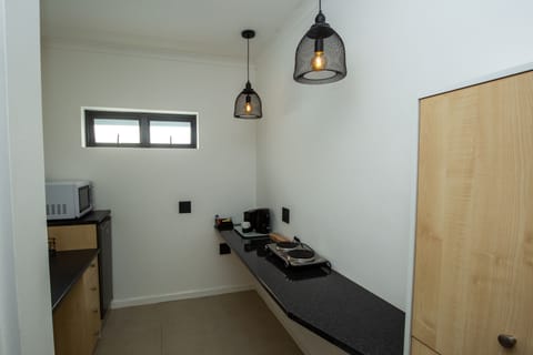 Classic Room 5= Amanzi= double room with kitchenette, 2 single beds with or without topping | Private kitchen | Espresso maker, coffee/tea maker, electric kettle