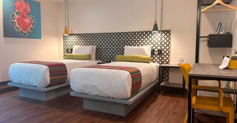 Family Studio Suite | Minibar, in-room safe, individually decorated, individually furnished