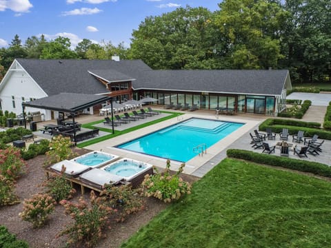 Backyard Oasis with Main House Heated Pool (open May 1-October 31), Hot Tubs (open all year long!), Pergola Lounge Area, Poolside Fire Pit & Sandbox for the Kiddos!
