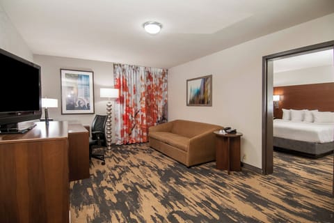 Suite, 1 Bedroom | Desk, laptop workspace, blackout drapes, iron/ironing board