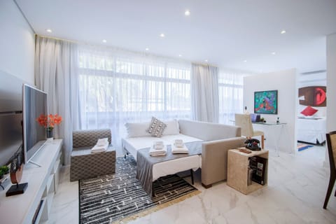 Villa | Living area | 60-inch TV with cable channels