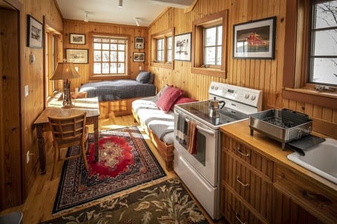 The Bunkhouse Kitchen and twin beds.