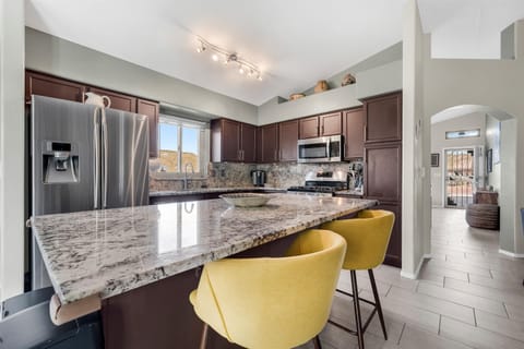 Kitchen with granite island—perfect for cooking, entertaining, and gathering.