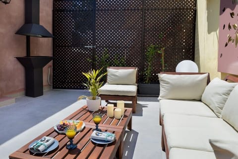 Relaxing Third-Floor Outdoor Space with BBQ and Seating