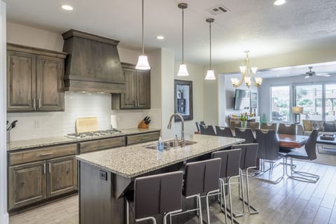 Kitchen Side View - The Kitchen Island comfortably seats 4 adults and creates a great space for serving and preparing meals.