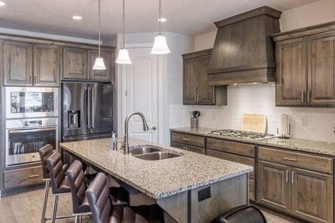 Kitchen - The kitchen is fully stocked with all the dishes, cookware, baking pans, and cutlery you will need for meal preparations and includes stainless steel appliances and granite counter tops.