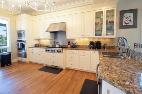 Your fully equipped gourmet kitchen awaits with granite countertops, stainless steel appliances, and everything you need to create memorable meals together.