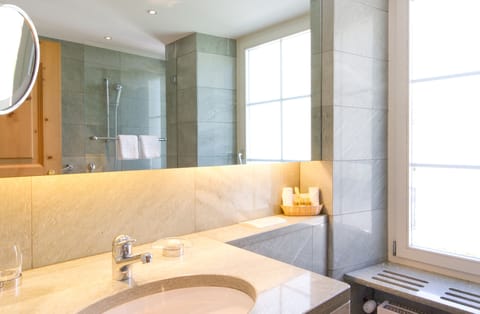 Shower, hair dryer, slippers, towels