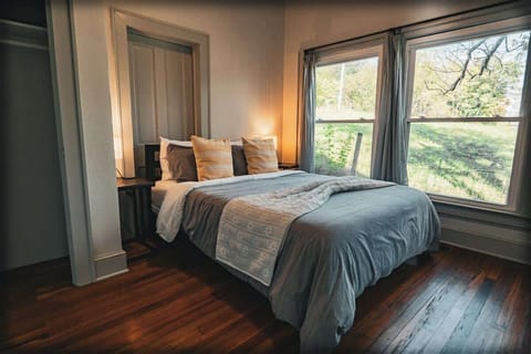Bedroom with large windows and soft lighting