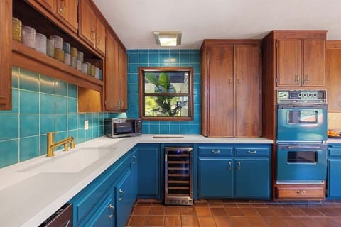 Fully stocked kitchen with table that seats up to 6.