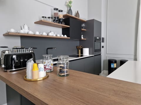 Mini-fridge, dishwasher, electric kettle, cookware/dishes/utensils