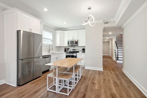 Kitchen- well equipped, ice maker, water dispenser, pot filler, stovetop and oven, coffee maker, coffee, creamer, sugar, filters, wine glasses