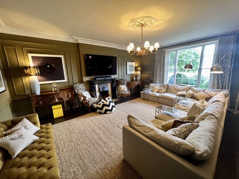 Family Lounge - huge L shape sofa and 70inch QLED TV