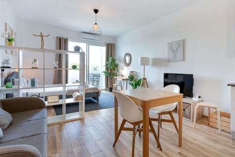 Relax and enjoy your favorite show or catch up on the event of the world in the comfiness of this open-plan living area/bedroom with A/C, cable TV, and balcony access #airbnbalgarve #portugal #pt #algarve