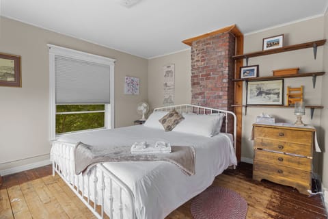 Spacious bedroom 1 featuring a luxurious king-sized bed for your comfort.