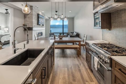 Thermador appliances, gas cooktop and Quartz countertops.