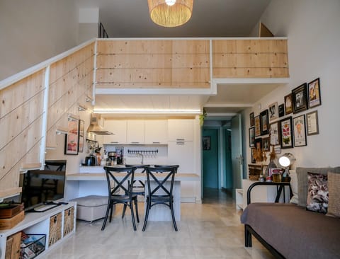 View from the entrance: living space with kitchen and mezzanine (kids room)