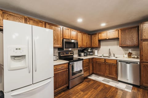 Updated & stocked with standard kitchen & cooking supplies. Seating for 6.