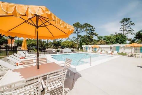 Poolside Paradise: Dive into relaxation with vibrant umbrellas and inviting lounge spots!