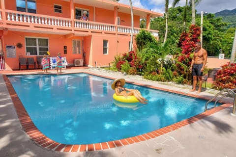 Beautiful large pool with surrounding lush greenery