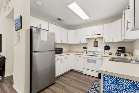 Enjoy a spacious kitchen with modern appliances and plenty of room to prep meals during your New Braunfels river getaway.