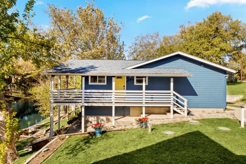 Welcome to Water Haus—a charming riverfront retreat nestled directly on the peaceful Guadalupe River between the 3rd and 4th Crossing along historic River Road.