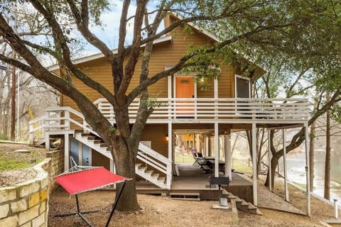 Step into your riverside cabin, nestled among shaded trees with inviting outdoor seating. With easy access to the Guadalupe River, it’s an ideal retreat for families and groups.
