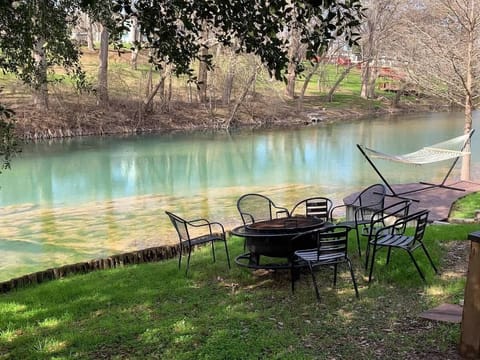 Relax at your private riverside seating area with beautiful Guadalupe River views — perfect for coffee, fishing, or unwinding after a day on the water.