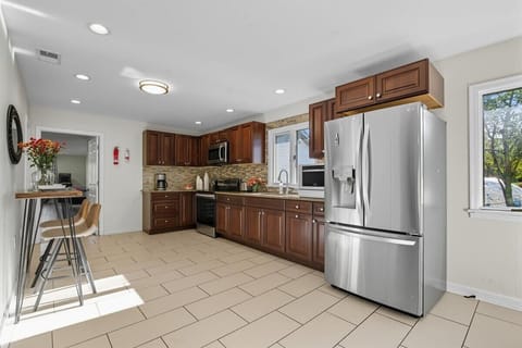 Fully equipped chef’s kitchen with modern appliances — cook up family feasts. - The Coolbaugh - East Stroudsburg, PA