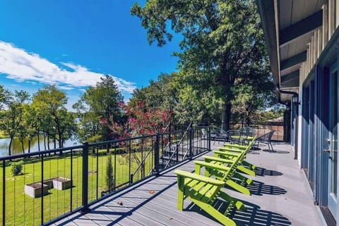 A second story porch overlooking the sizable back yard and the lake!