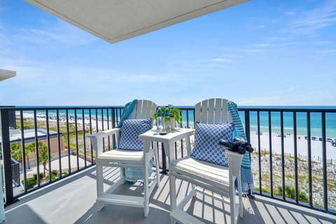 Unwind on your private balcony with two comfy chairs and a small table, perfectly positioned for morning coffee and breathtaking ocean views.