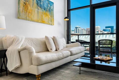 Luxury leather sofa and local art. Amazing views from the ceiling to floor windows and off the patio!