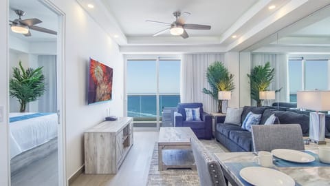 The living room with its access to the patio through sliding glass doors.