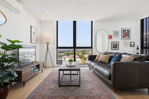 Relax on or comfy couch and enjoys the light filled living space