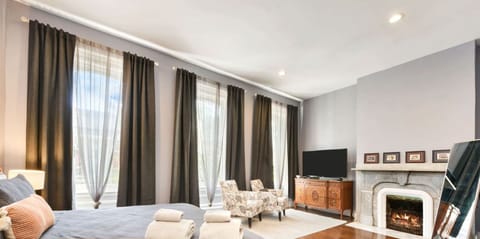 The home features two master bedroom suites. The second floor master offers a whole separate seating space, for couples who`d prefer more peace and privacy.