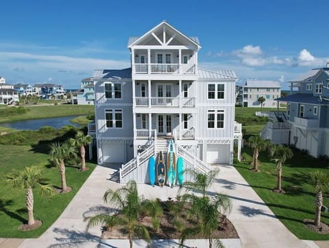 Timeless beach architecture with front and back porches on every level, enjoy the coastal breeze right from your room