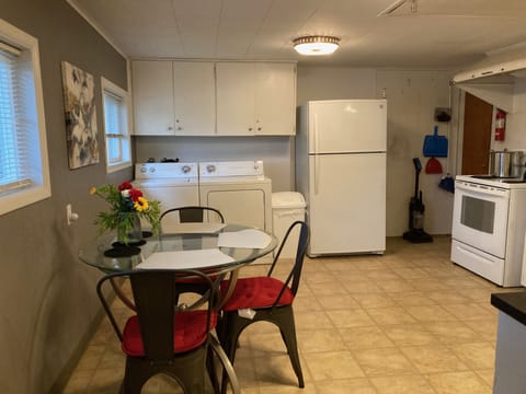 Full kitchen. W/D on back wall. Utility closet in corner.